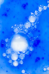 Close up of Blue Copper Peptides in Powder and Liquid Form