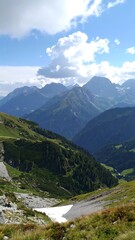 Alpine valley vista on a partly cloudy day