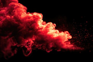 Red smoke plume against a black backdrop with fine scattered particles