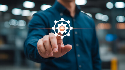 Activating machinery: a person interacts with an interface to start a gear-driven mechanism.