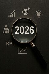Examining 2026 through a magnifying glass, surrounded by various business icons. 