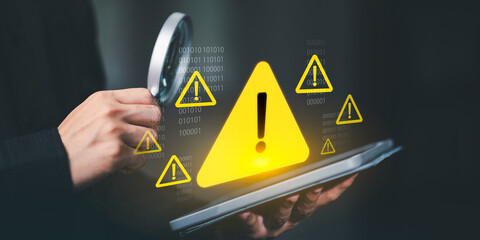 Cybersecurity warning concept with glowing yellow alert icons, binary code, and digital risk symbols representing online safety, data protection, and system threat prevention.