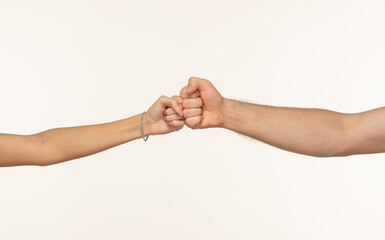 Fototapeta premium Rock-paper-scissors gesture shown by male and female hands