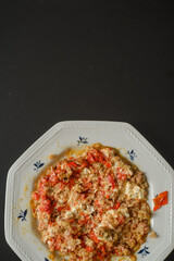 Stuffed red pointed peppers baked with meat inside and sweet cream ready to eat