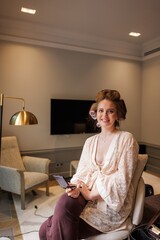 Woman getting ready in a cozy room with modern decor and elegant style