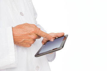 Hands wearing white lab coat tapping touchscreen tablet on plain white background, copy space