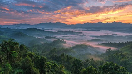 Sunrise over misty mountain range (1)