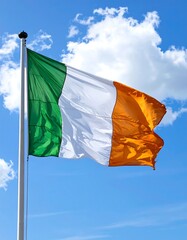 Irish flag waving in a clear blue sky