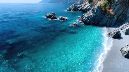 Fototapeta premium Aerial View of Turquoise Sea and Rocky Coastline in Sunny Weather Coastal Scenery with Crystalline Water Sparkling Under Clear Sky