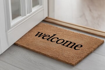 Welcome doormat on light floor