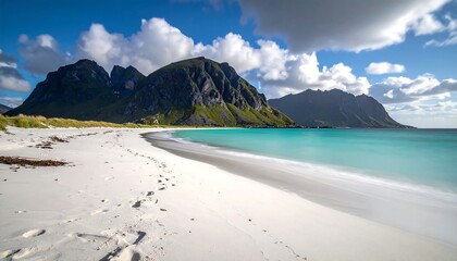 Pristine beach with turquoise water and mountains