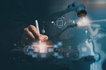 Factory control concept of a professional using a tablet with AI and cybersecurity overlays to manage robotic arms in a smart factory, highlighting automation, data protection, and firewall security.