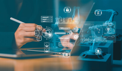 Factory control concept professional using tablet and stylus with holographic interface operate robotic arms, overlaying lock, firewall icons to emphasize cybersecurity, data protection, automation.