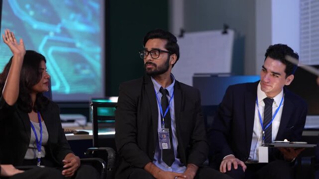 In a corporate war room, a strategy team interacts with an immersive AI driven simulation on a holographic display, wargaming market scenarios and making data backed decisions.