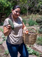 Woman Working in a Vegetable Garden with Fresh Produce