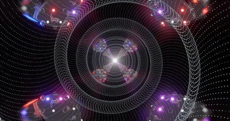 Vibrant light patterns create a swirling spiral effect at night