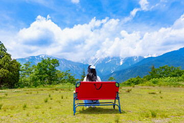 woman is relaxing at a mountain viewpoint.