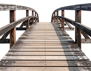 Aged wooden bridge extending into distance