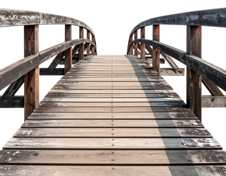 Aged wooden bridge extending into distance