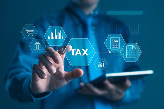 Businessman using digital tax interface and tablet device for online tax filing, financial analysis and modern business management technology