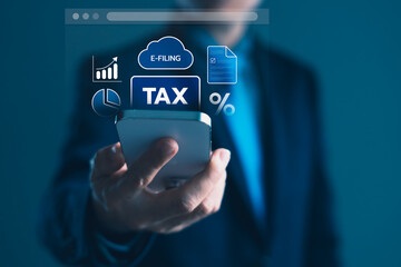 Businessman using smartphone for e-filing tax with digital icons of finance, percentage, document, and chart for online taxation and mobile financial planning