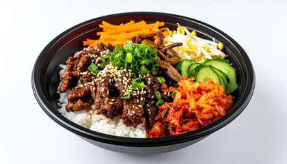 Korean bibimbap dish served in a black bowl on a plain white background