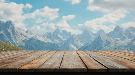 Rustic wooden table with majestic snow capped mountains and cloudy blue sky background