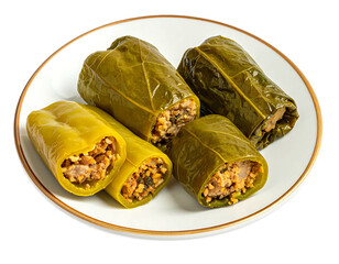 Stuffed green peppers and grape leaves on a plate
