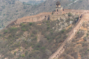 Red Sandstone Fortification Wall and Watchtower Ascending a Hill © shijo