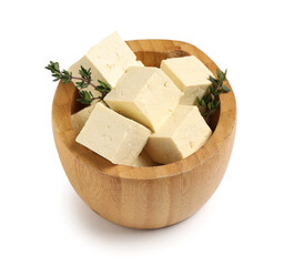 Wooden bowl with cut tofu cheese isolated on white background