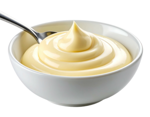 Creamy, pale yellow sauce in a bowl, a spoon dips in