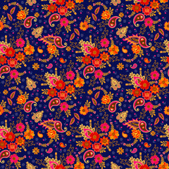 Seamless pattern with bright paisley and flowers on a dark blue background in folk design. Indian motifs. Festive colorful print for fabric.