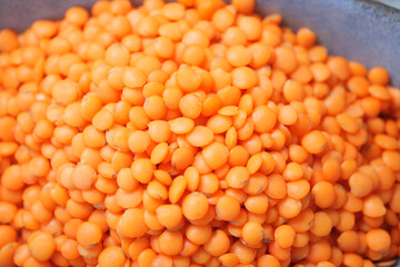 Bright orange lentils in a market display