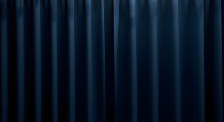 Deep blue elegant curtain with vertical folds and rich fabric texture. Soft lighting creates a luxurious backdrop, ideal for stage or interior design.