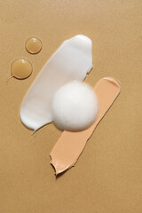 Samples of natural cosmetic products on beige background