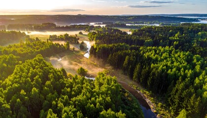 Sunrise over a misty river valley