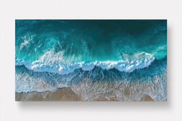 Aerial view of crashing waves on a sandy beach