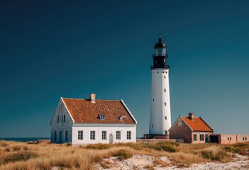 Coastal lighthouse and houses on a sunny day