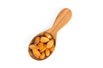 A wooden spoon holds a small pile of whole almonds on a white background.