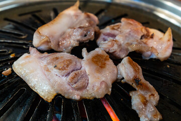 roasting pork on the charcoal grill