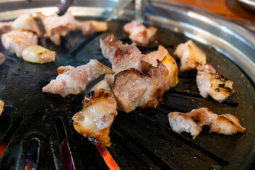 roasting pork on the charcoal grill