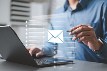 Business professional using digital email communication system for online messaging, business contact, and email marketing.