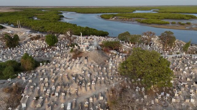 Aerial drone of Joal Fadiouth shell cemetery in Senegal, sacred interfaith burial ground built on seashells
