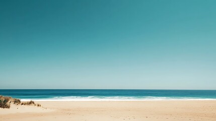 Obraz premium Serene beach scene with vast turquoise ocean meeting golden sand with clear blue sky for peaceful tranquil scenic natural landscape relaxing serene tropical outdoor beauty concept