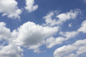 Blue sky with puffy clouds