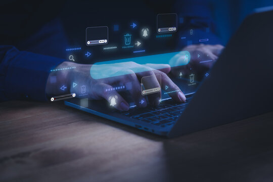 Man using a laptop computer with digital interface for video content moderation. Concept of online streaming, video platform, content removal, copyright protection, AI moderation and digital safety.