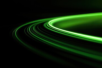 Abstract swirling green light trails on a dark background