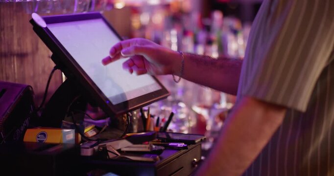 Pub pos. Cafe touch screen. Cashier hand preparing bill at desk. Male worker using modern computer on bar counter choosing option.