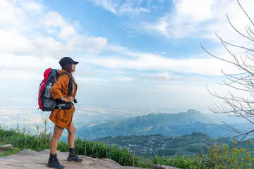 Hiker woman feeling victorious facing  on the mountain and celebrate success together on mt summit