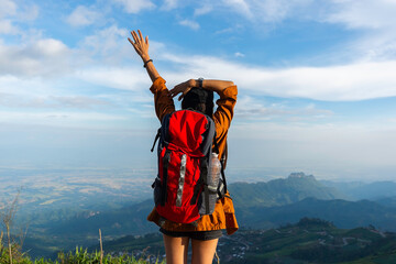 Hiker woman feeling victorious facing  on the mountain and celebrate success together on mt summit